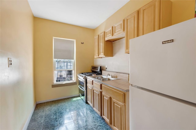 1478 Union St, Brooklyn, NY 11213 - kitchen with freestanding refrigerator, double oven range, light brown cabinetry, and light countertops