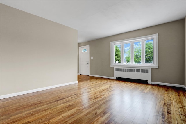 31 Tappan Ave, Babylon, NY 11702 - spare room with radiator and hardwood / wood-style floors