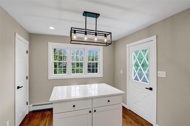 31 Tappan Ave, Babylon, NY 11702 - kitchen featuring baseboard heating, plenty of natural light, dark wood-type flooring, and recessed lighting