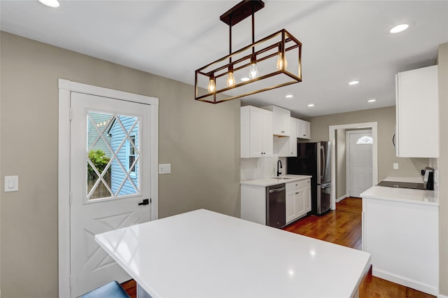 31 Tappan Ave, Babylon, NY 11702 - kitchen featuring appliances with stainless steel finishes, dark wood finished floors, white cabinetry, light countertops, and recessed lighting