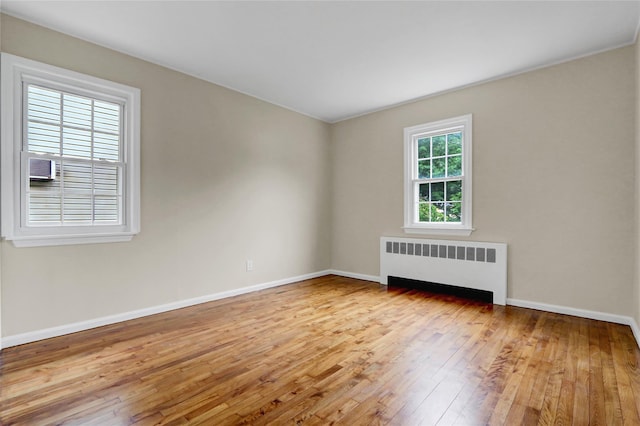 31 Tappan Ave, Babylon, NY 11702 - unfurnished room with radiator heating unit and hardwood / wood-style flooring