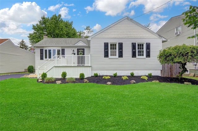 31 Tappan Ave, Babylon, NY 11702 - view of front of home with a chimney, a deck, and stairway