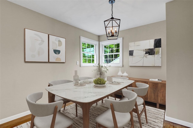 31 Tappan Ave, Babylon, NY 11702 - dining area with wood finished floors and a chandelier