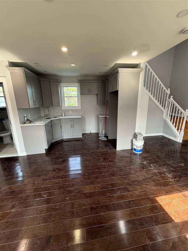 4006 Rockaway Beach Blvd, Edgemere, NY 11691 - kitchen with gray cabinetry, dark wood-type flooring, recessed lighting, and light countertops