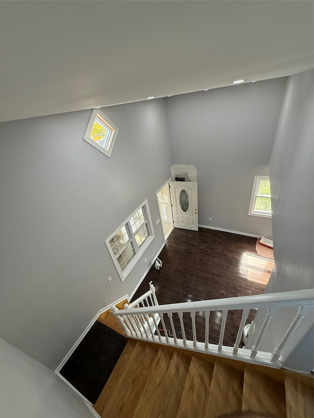 4006 Rockaway Beach Blvd, Edgemere, NY 11691 - staircase with wood finished floors and baseboards