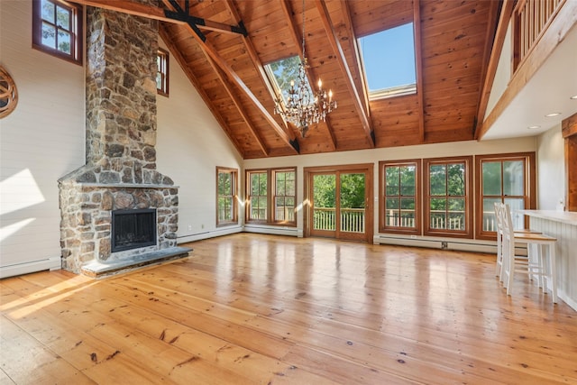 25 Cascade Lake Rd, Warwick, NY 10990 - unfurnished living room featuring high vaulted ceiling, wood-type flooring, a chandelier, a fireplace, and a baseboard heating unit