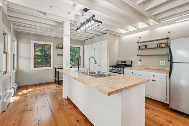 25 Cascade Lake Rd, Warwick, NY 10990 - kitchen with stainless steel appliances, butcher block counters, light wood-type flooring, beam ceiling, and open shelves