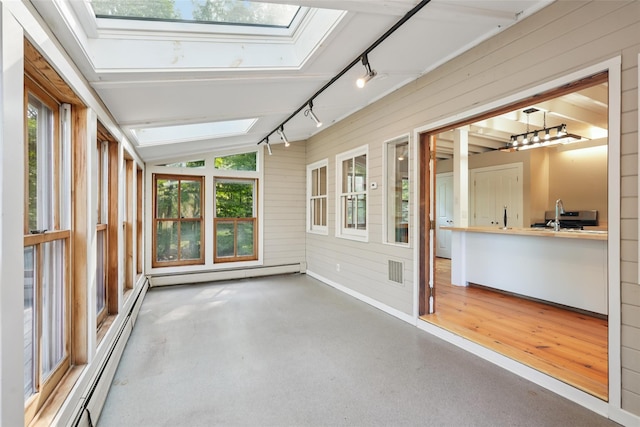 25 Cascade Lake Rd, Warwick, NY 10990 - unfurnished sunroom featuring a skylight, a baseboard radiator, track lighting, wood walls, and lofted ceiling