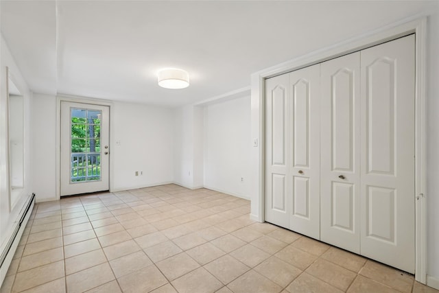 25 Cascade Lake Rd, Warwick, NY 10990 - unfurnished bedroom featuring a baseboard heating unit, light tile patterned floors, and access to outside