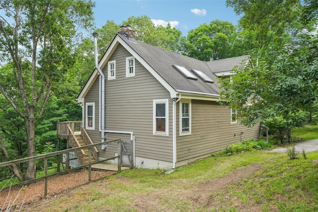 25 Cascade Lake Rd, Warwick, NY 10990 - view of home's exterior featuring a chimney, a deck, a shingled roof, and stairway