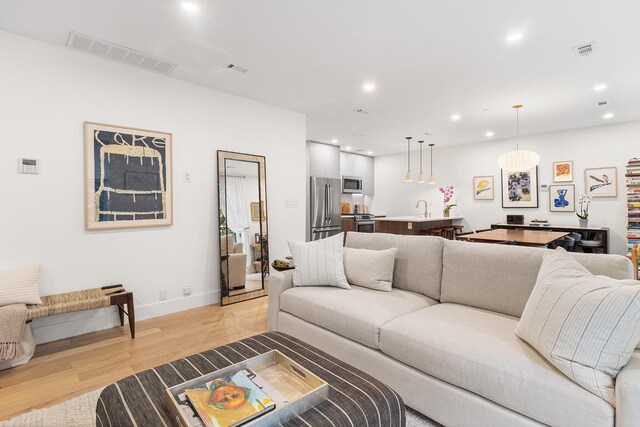 334 22nd St Unit 2B, Brooklyn, NY 11215 - living room with light wood-style floors and recessed lighting