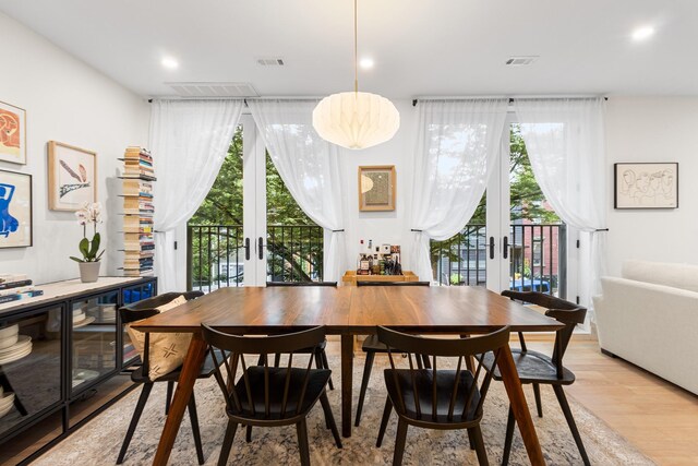 334 22nd St Unit 2B, Brooklyn, NY 11215 - dining room with french doors, light wood finished floors, and healthy amount of natural light