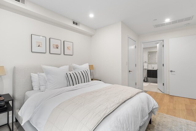 334 22nd St Unit 2B, Brooklyn, NY 11215 - bedroom with light wood finished floors, recessed lighting, and connected bathroom