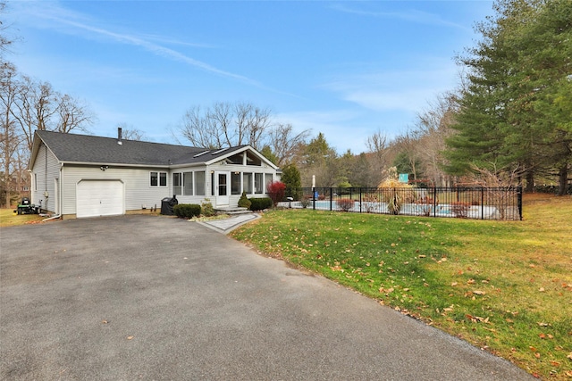127 Continental Rd, Cornwall, NY 12518 - view of front of house with a garage, asphalt driveway, a sunroom, and a shingled roof