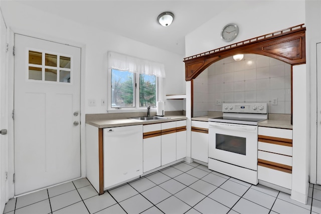 127 Continental Rd, Cornwall, NY 12518 - kitchen with white appliances, light countertops, white cabinets, light tile patterned floors, and backsplash
