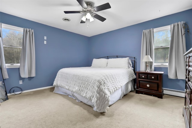 127 Continental Rd, Cornwall, NY 12518 - carpeted bedroom with baseboard heating, multiple windows, and a ceiling fan
