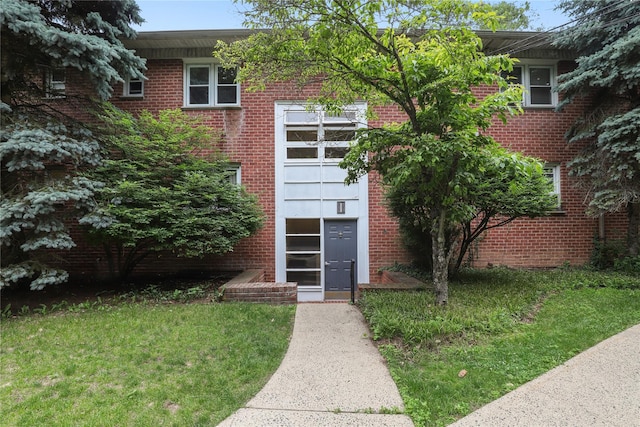 140 N Broadway Unit It9, Irvington, NY 10533 - view of front of home with brick siding and a front yard