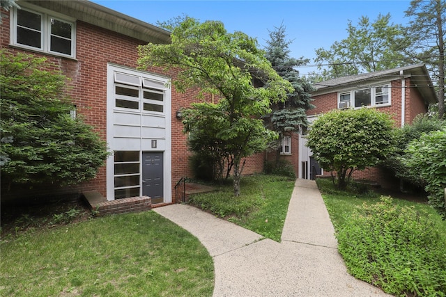 140 N Broadway Unit It9, Irvington, NY 10533 - view of front of house featuring brick siding and a front lawn