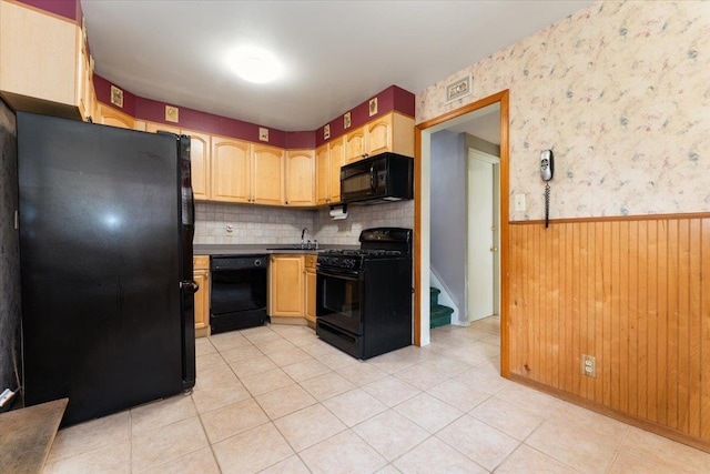 3183 Waterbury Ave, Bronx, NY 10465 - kitchen with black appliances, wainscoting, decorative backsplash, wallpapered walls, and light tile patterned floors