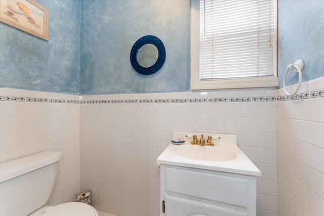 3183 Waterbury Ave, Bronx, NY 10465 - bathroom featuring tile walls, vanity, and a wainscoted wall