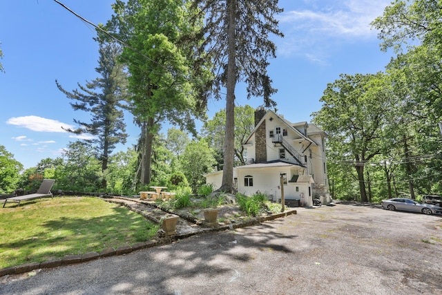 42 N Healy Ave, Hartsdale, NY 10530 - view of front of house with a front lawn
