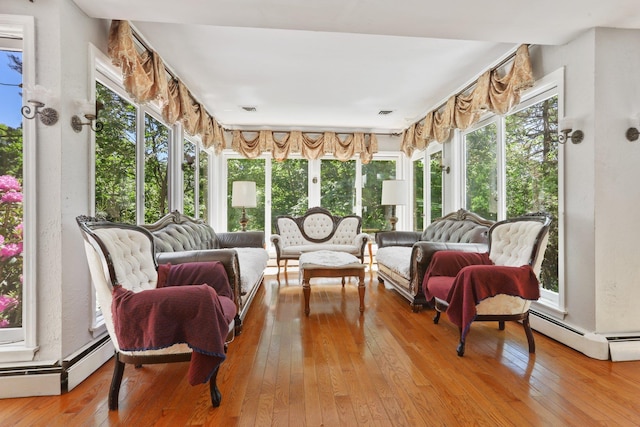 42 N Healy Ave, Hartsdale, NY 10530 - sunroom featuring hardwood / wood-style flooring and a baseboard radiator
