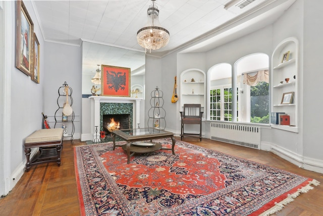 42 N Healy Ave, Hartsdale, NY 10530 - living room featuring radiator heating unit, a chandelier, and a fireplace