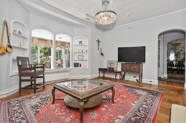 42 N Healy Ave, Hartsdale, NY 10530 - living room featuring built in shelves, a chandelier, arched walkways, and parquet flooring