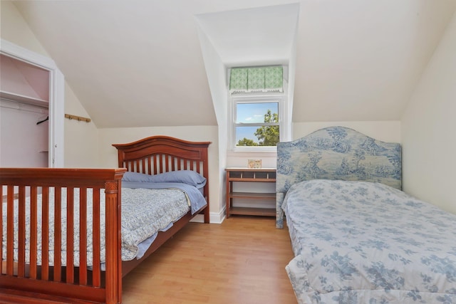 42 N Healy Ave, Hartsdale, NY 10530 - bedroom featuring wood finished floors and vaulted ceiling