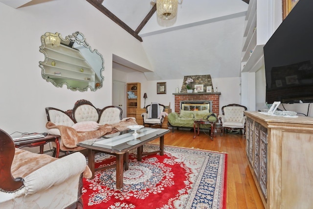 42 N Healy Ave, Hartsdale, NY 10530 - living area with a brick fireplace, wood-type flooring, and high vaulted ceiling