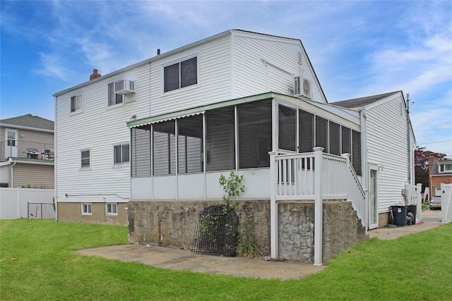 10 Marilyn Ct, West Babylon, NY 11704 - rear view of house with a sunroom, a lawn, a chimney, and a wall mounted AC