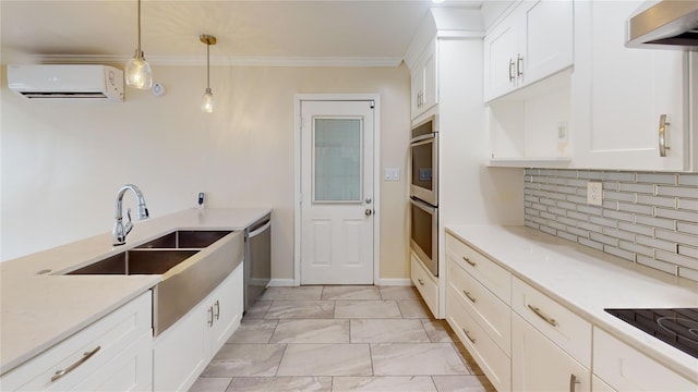 10 Marilyn Ct, West Babylon, NY 11704 - kitchen with a wall mounted AC, extractor fan, appliances with stainless steel finishes, hanging light fixtures, and white cabinetry