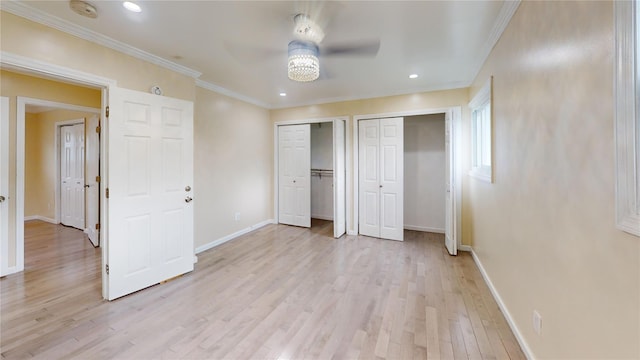10 Marilyn Ct, West Babylon, NY 11704 - unfurnished bedroom featuring multiple closets, light wood-style floors, ornamental molding, recessed lighting, and ceiling fan