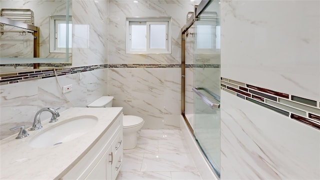 10 Marilyn Ct, West Babylon, NY 11704 - full bath with a marble finish shower, vanity, tile walls, and marble tiled flooring