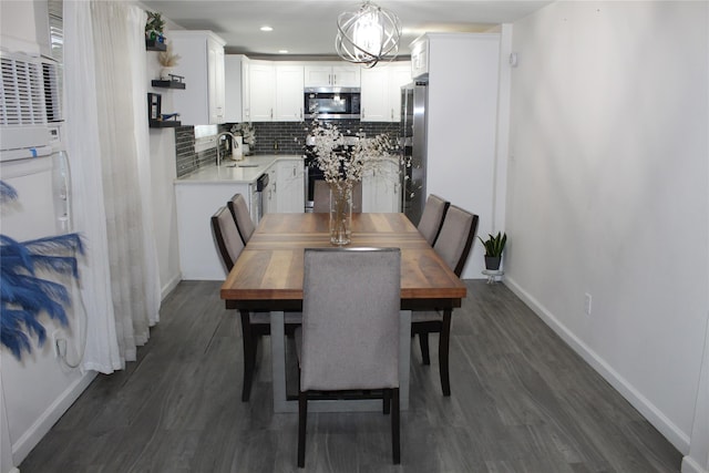 10 Marilyn Ct, West Babylon, NY 11704 - dining room with dark wood-style floors, recessed lighting, and a chandelier