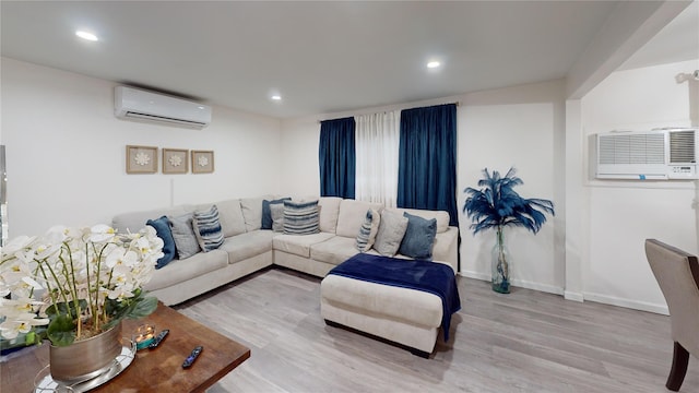 10 Marilyn Ct, West Babylon, NY 11704 - living area featuring a wall mounted air conditioner, light wood-style flooring, and recessed lighting