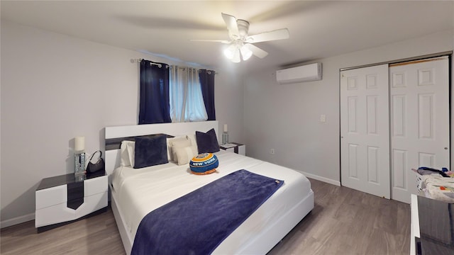 10 Marilyn Ct, West Babylon, NY 11704 - bedroom featuring a wall mounted AC, wood finished floors, ceiling fan, and a closet