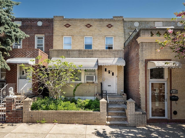 19-23 23rd Rd, Astoria, NY 11105 - view of front of home featuring brick siding and cooling unit