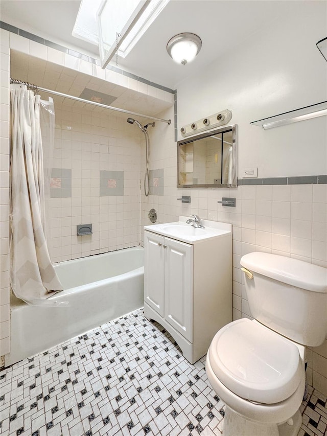 19-23 23rd Rd, Astoria, NY 11105 - full bath with shower / tub combo with curtain, vanity, tile walls, and a skylight