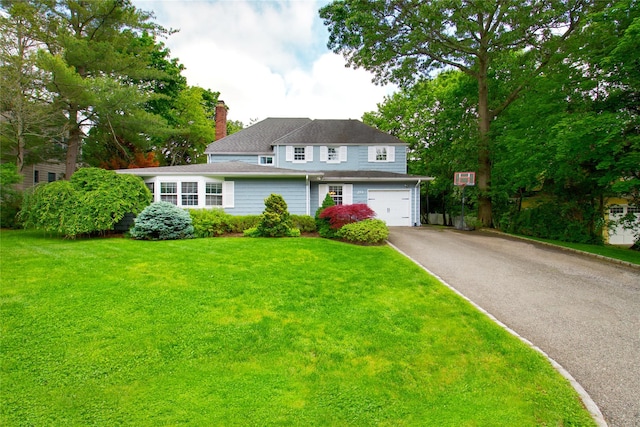 20 Primrose Ln, East Hills, NY 11577 - traditional-style home with driveway, a chimney, a front yard, and a garage