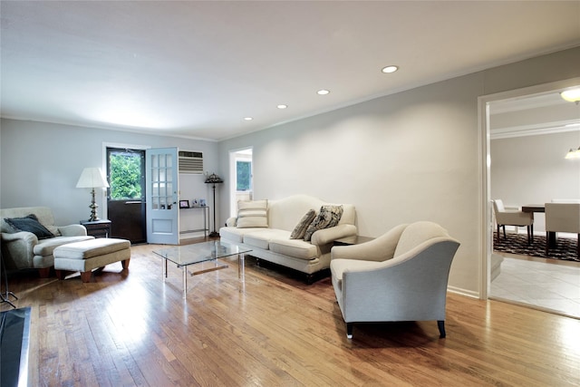 20 Primrose Ln, East Hills, NY 11577 - living area featuring light wood-style floors, crown molding, recessed lighting, an AC wall unit, and a baseboard heating unit