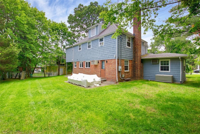 20 Primrose Ln, East Hills, NY 11577 - back of house featuring a chimney and a wall mounted AC