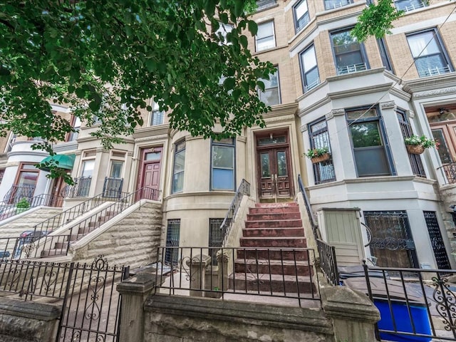 1269 Bergen St Hse, Unit Hse, Brooklyn, NY 11213 - view of building exterior featuring stairs and a fenced front yard
