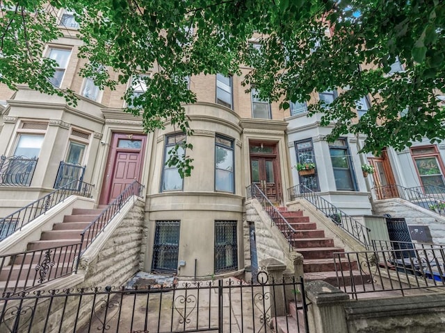 1269 Bergen St Hse, Unit Hse, Brooklyn, NY 11213 - view of front of property featuring stairway, a fenced front yard, and french doors