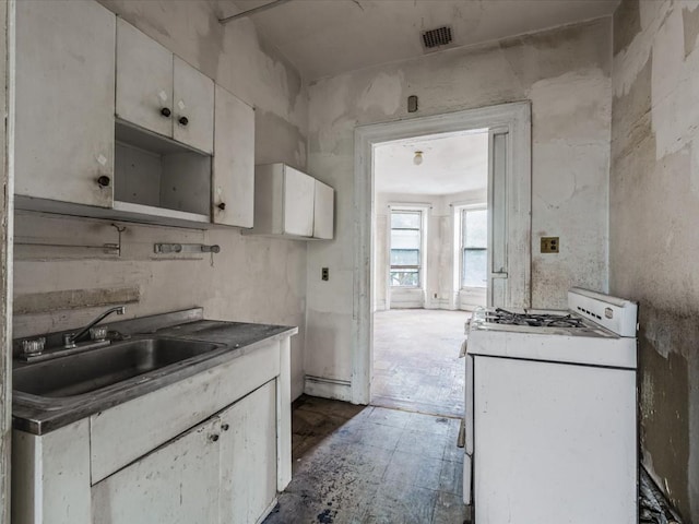 1269 Bergen St Hse, Unit Hse, Brooklyn, NY 11213 - kitchen featuring white gas stove and white cabinetry