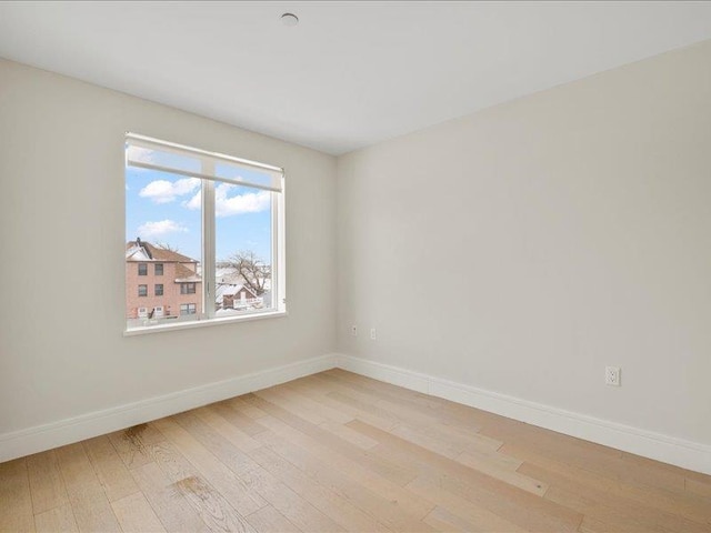 160 Bch 5th St, Far Rockaway, NY 11691 - unfurnished room featuring light wood-style flooring and baseboards
