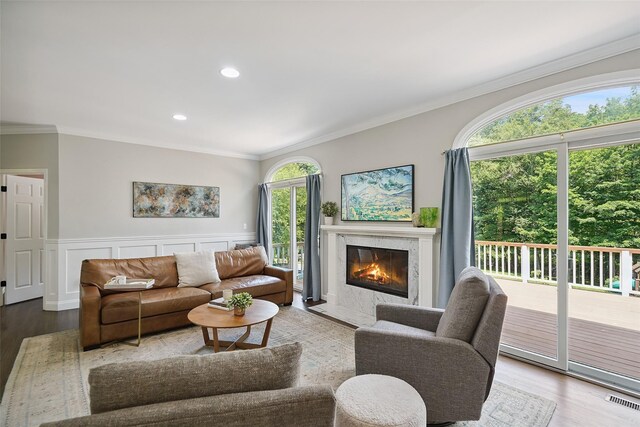 64 Lambert Rdg, Cross River, NY 10518 - living room with ornamental molding, wood finished floors, a fireplace, a wainscoted wall, and recessed lighting