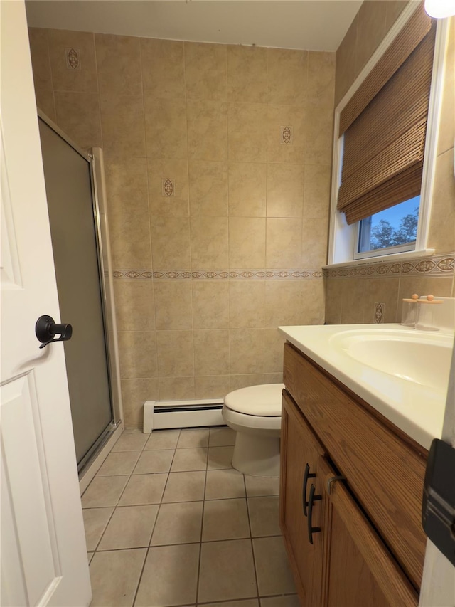5 Sabrina Ln, Ossining, NY 10562 - full bath with a baseboard radiator, tile patterned flooring, tile walls, a stall shower, and vanity