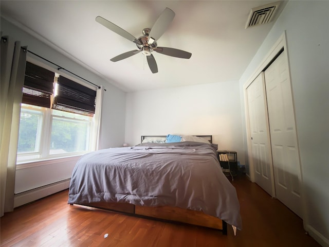 5 Sabrina Ln, Ossining, NY 10562 - bedroom featuring a baseboard radiator, wood finished floors, a closet, and a ceiling fan