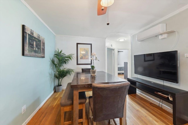 710 E 213th St, Bronx, NY 10467 - dining space with a wall mounted air conditioner, wood finished floors, and ornamental molding